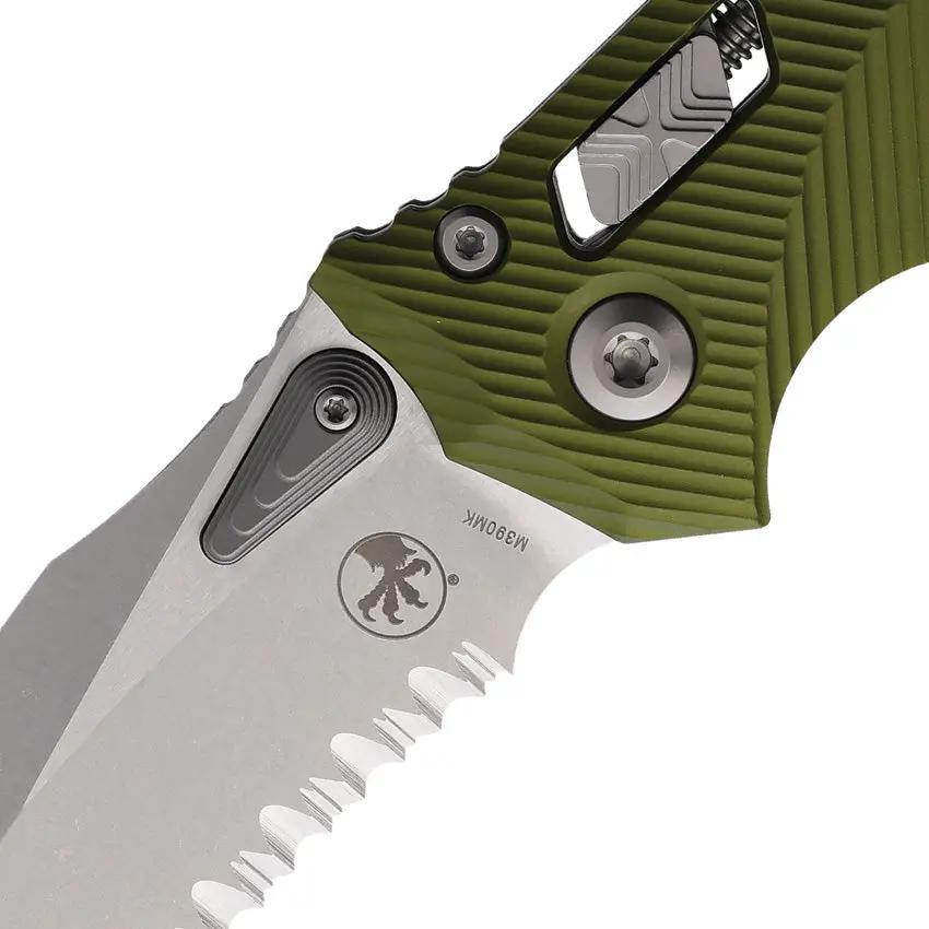 Microtech Amphibian S E Ram Lok OD Green G10 EDC Knife With 4In M390MK Blade Partial Serration Ball Bearing Thumb Stud by Microtech